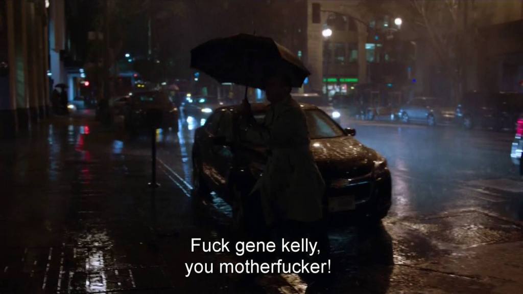 Albert sous une pluie battante crie "Fuck Gene Kelly, you motherfucker!"